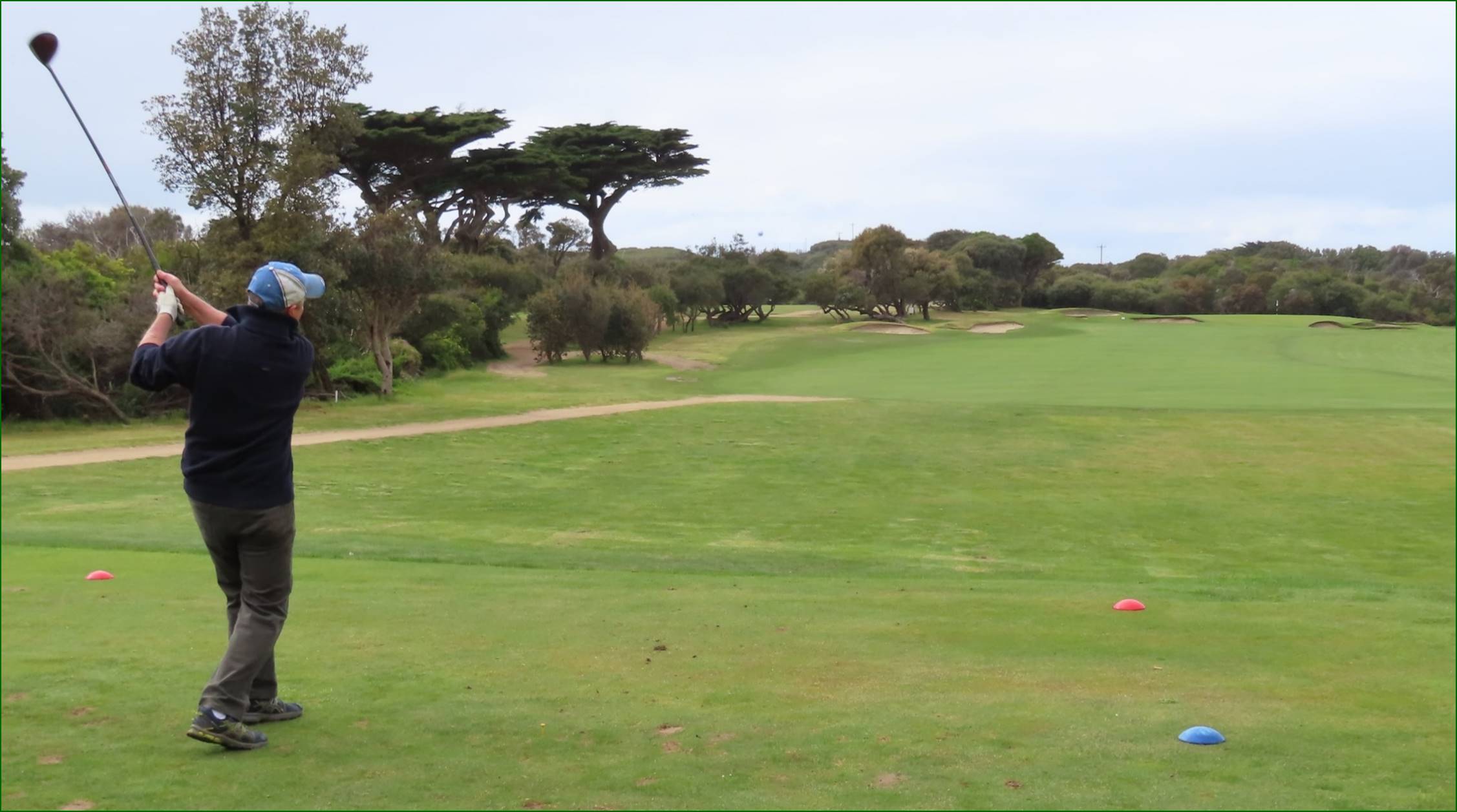 A person playing golf on a golf course

Description automatically generated
