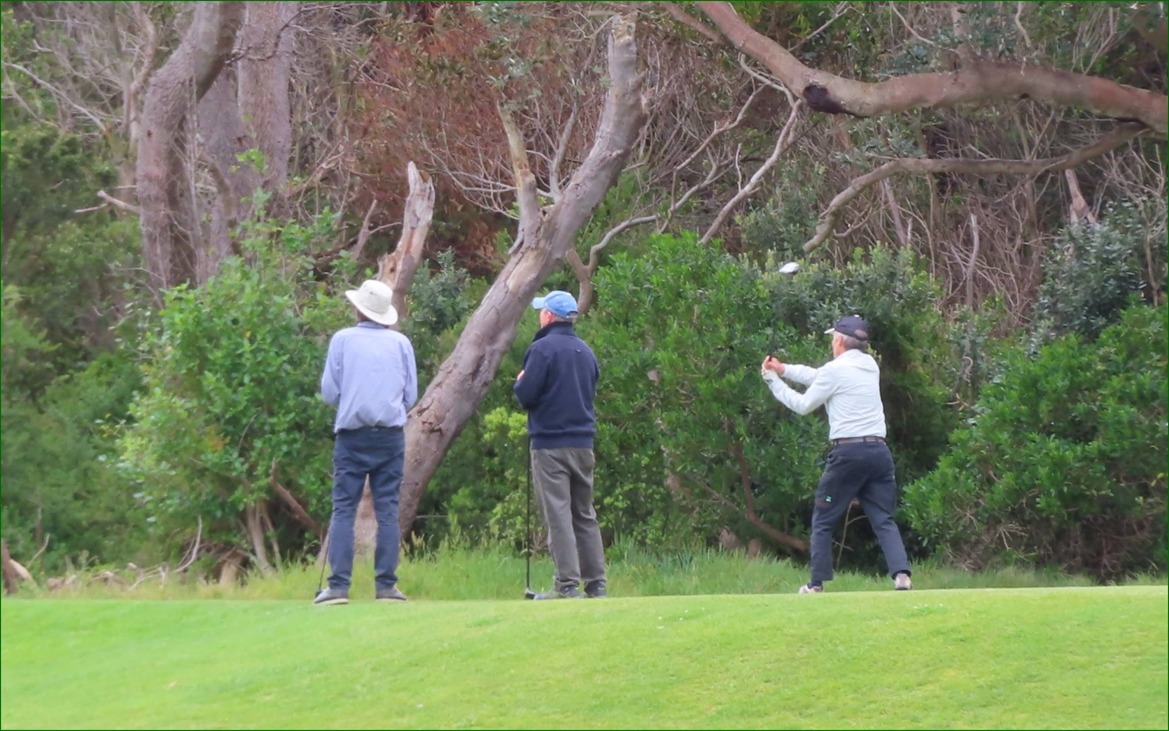 A group of men playing golf

Description automatically generated