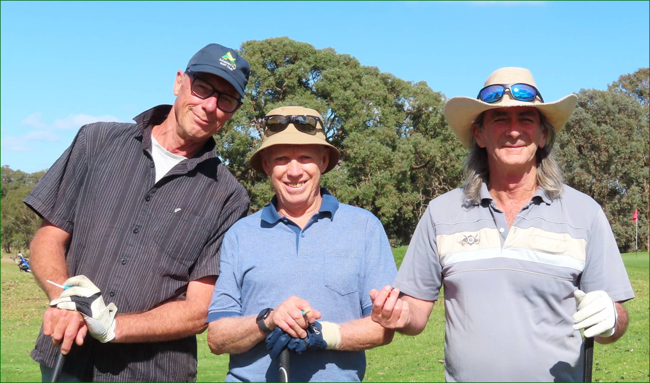 A group of men standing in a field

Description automatically generated