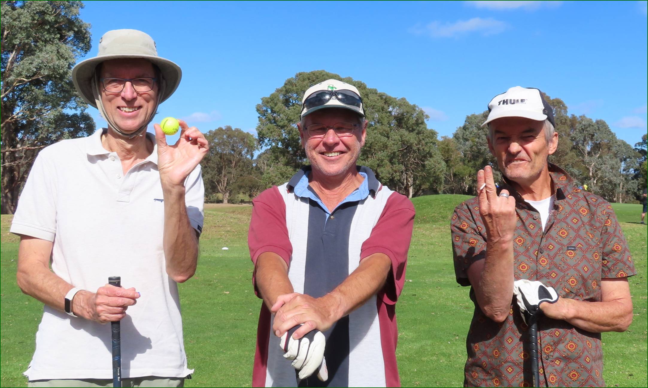 A group of men holding golf balls

Description automatically generated