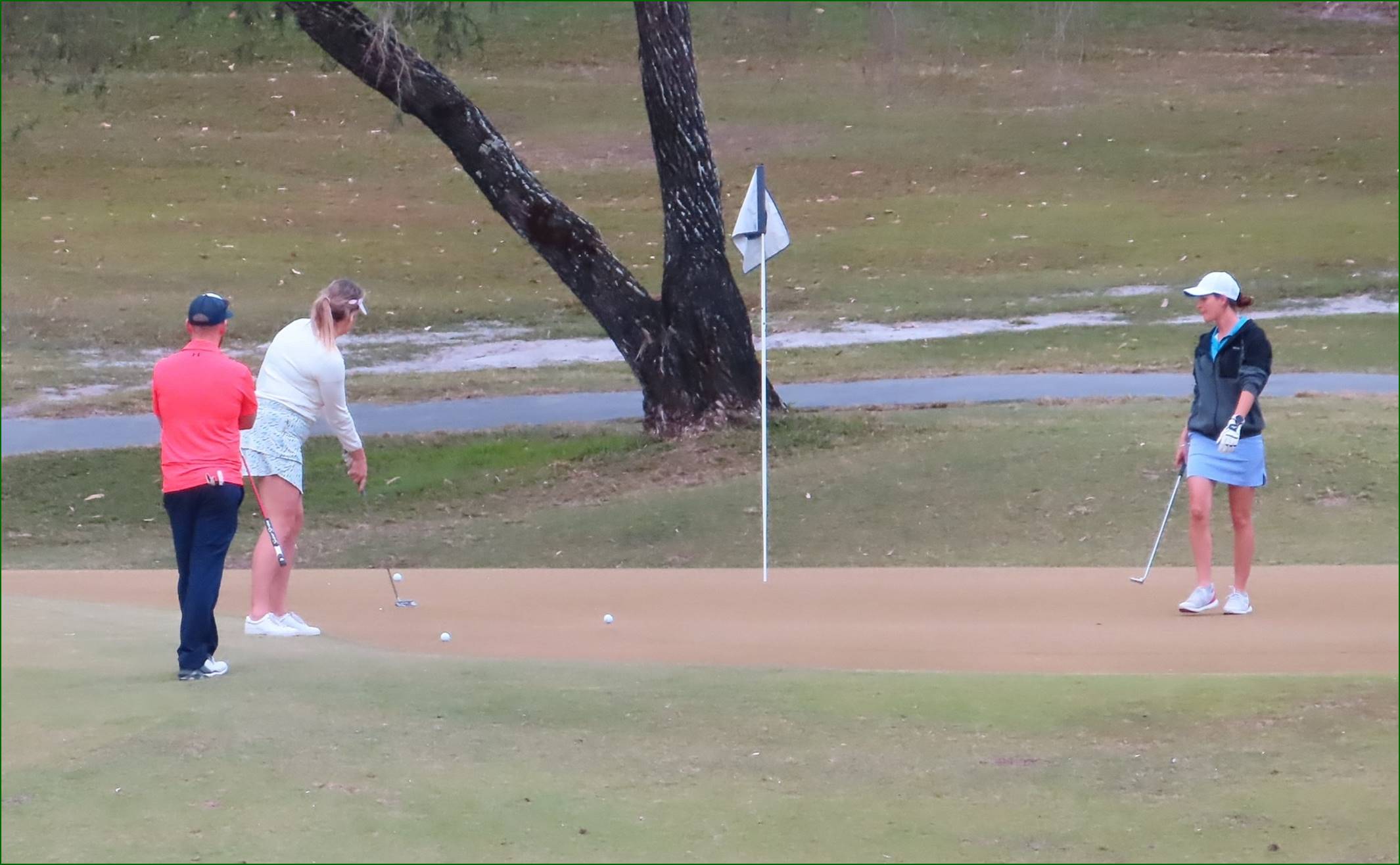 A person playing golf on a golf course

Description automatically generated