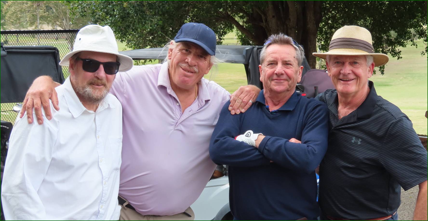 A group of men posing for a picture

Description automatically generated