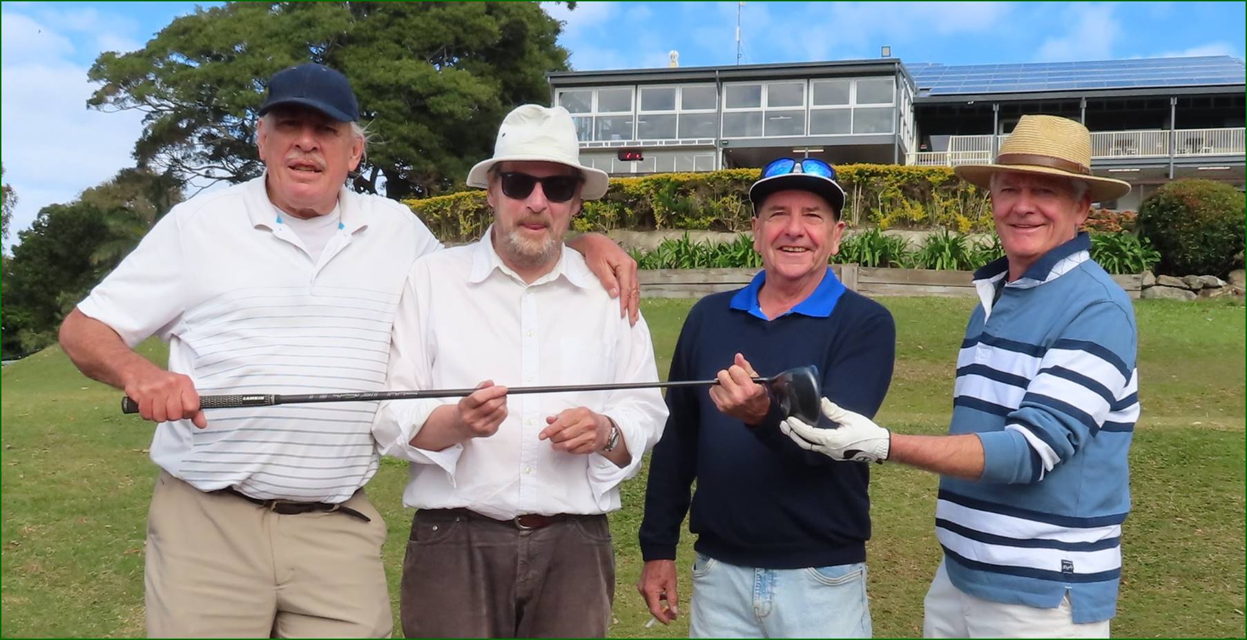 A group of men holding golf clubs

Description automatically generated