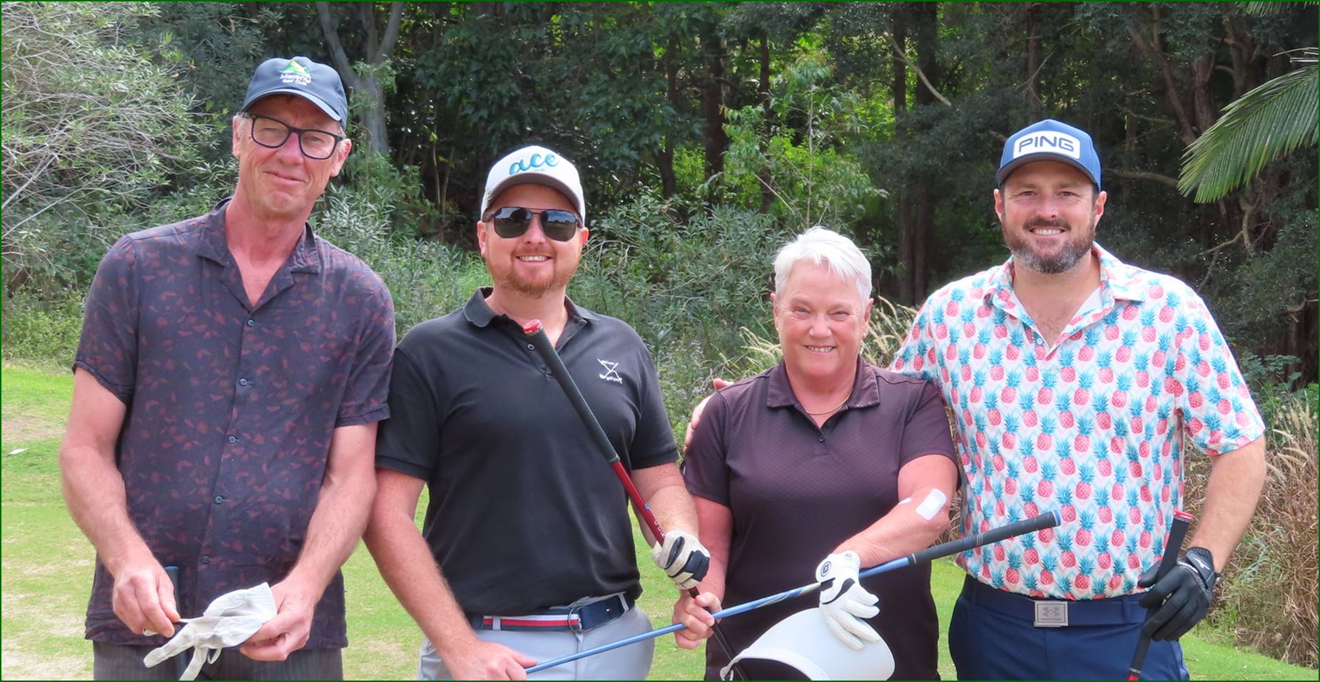 A group of people holding golf clubs

Description automatically generated
