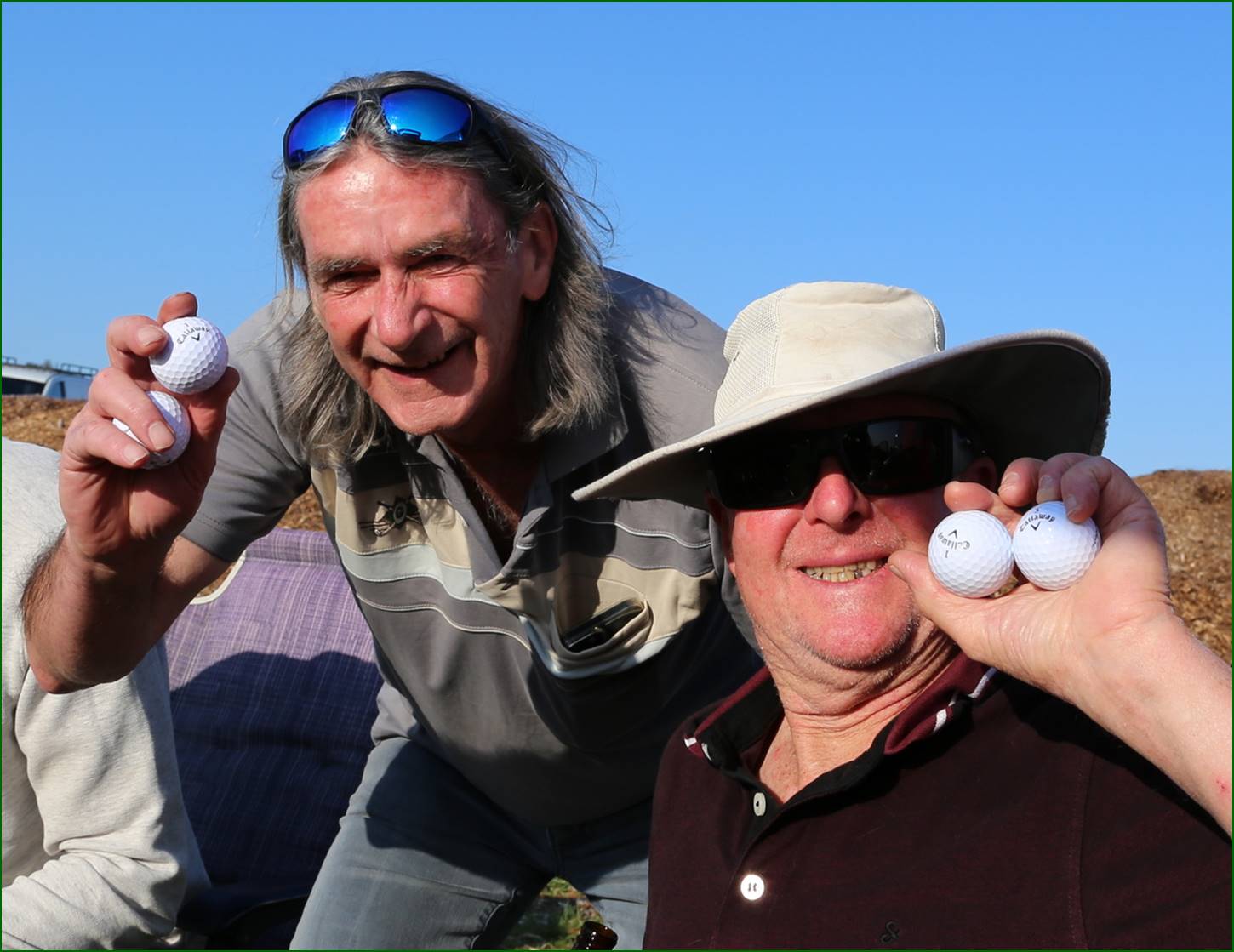 A group of men holding golf balls

Description automatically generated