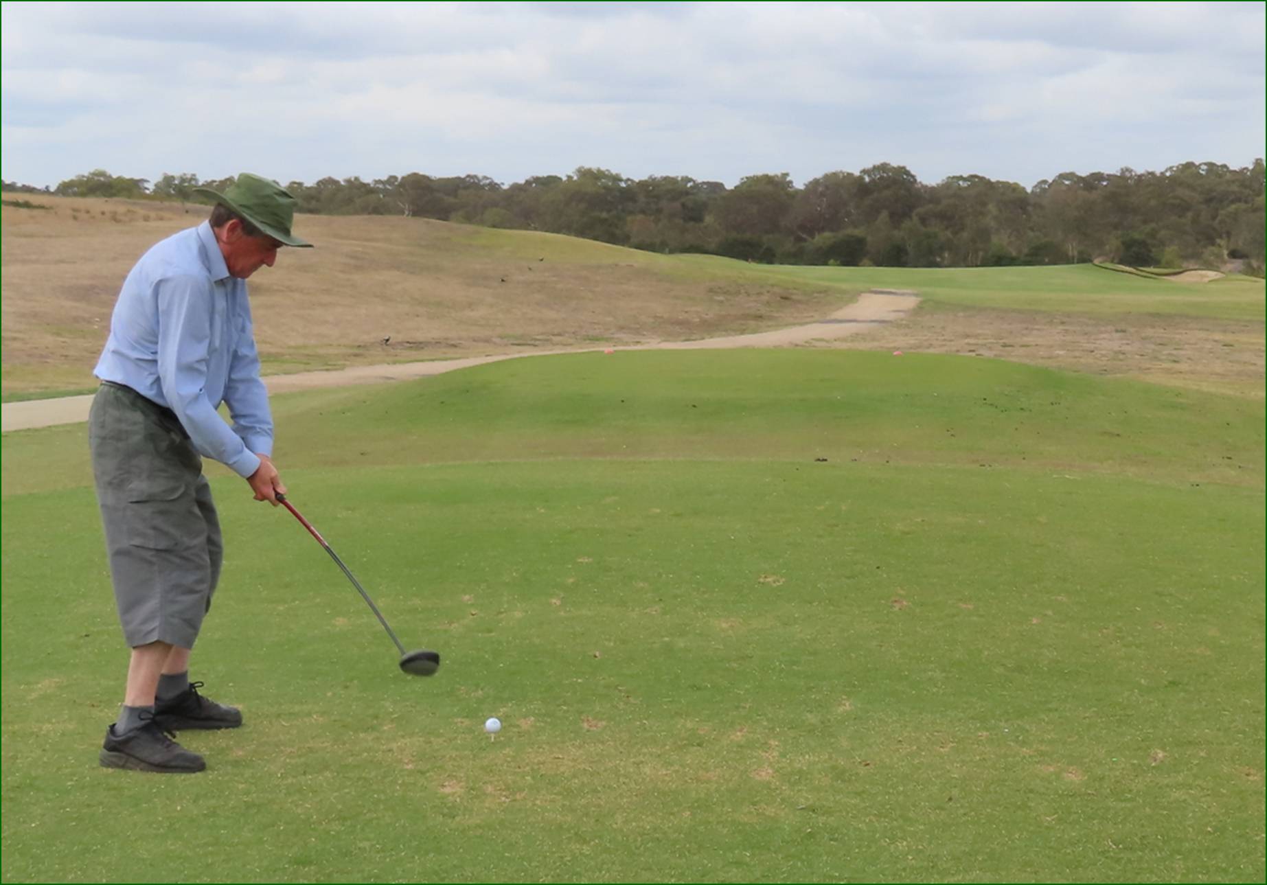 A person playing golf on a golf course

AI-generated content may be incorrect.