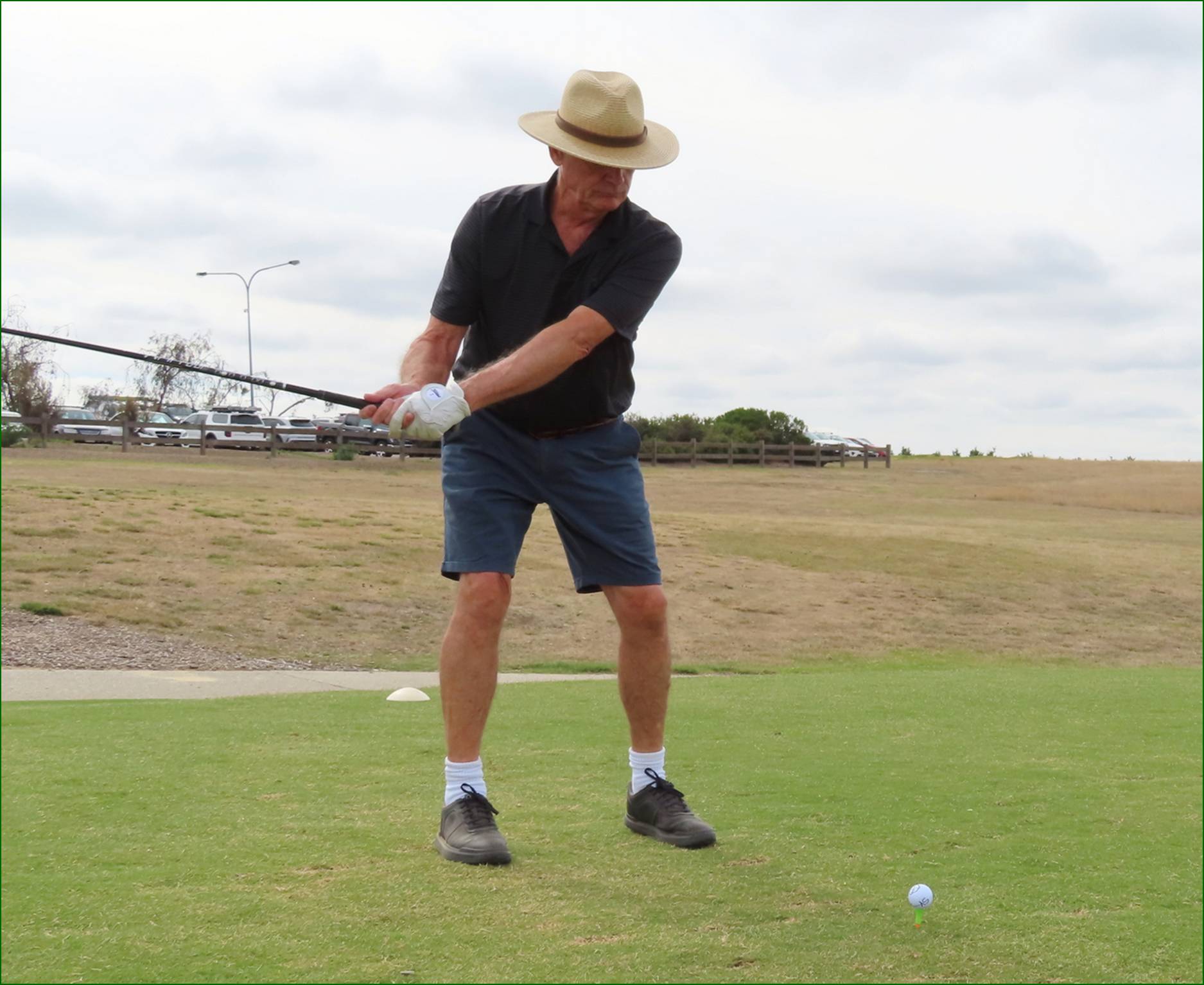 A person swinging a golf club

AI-generated content may be incorrect.