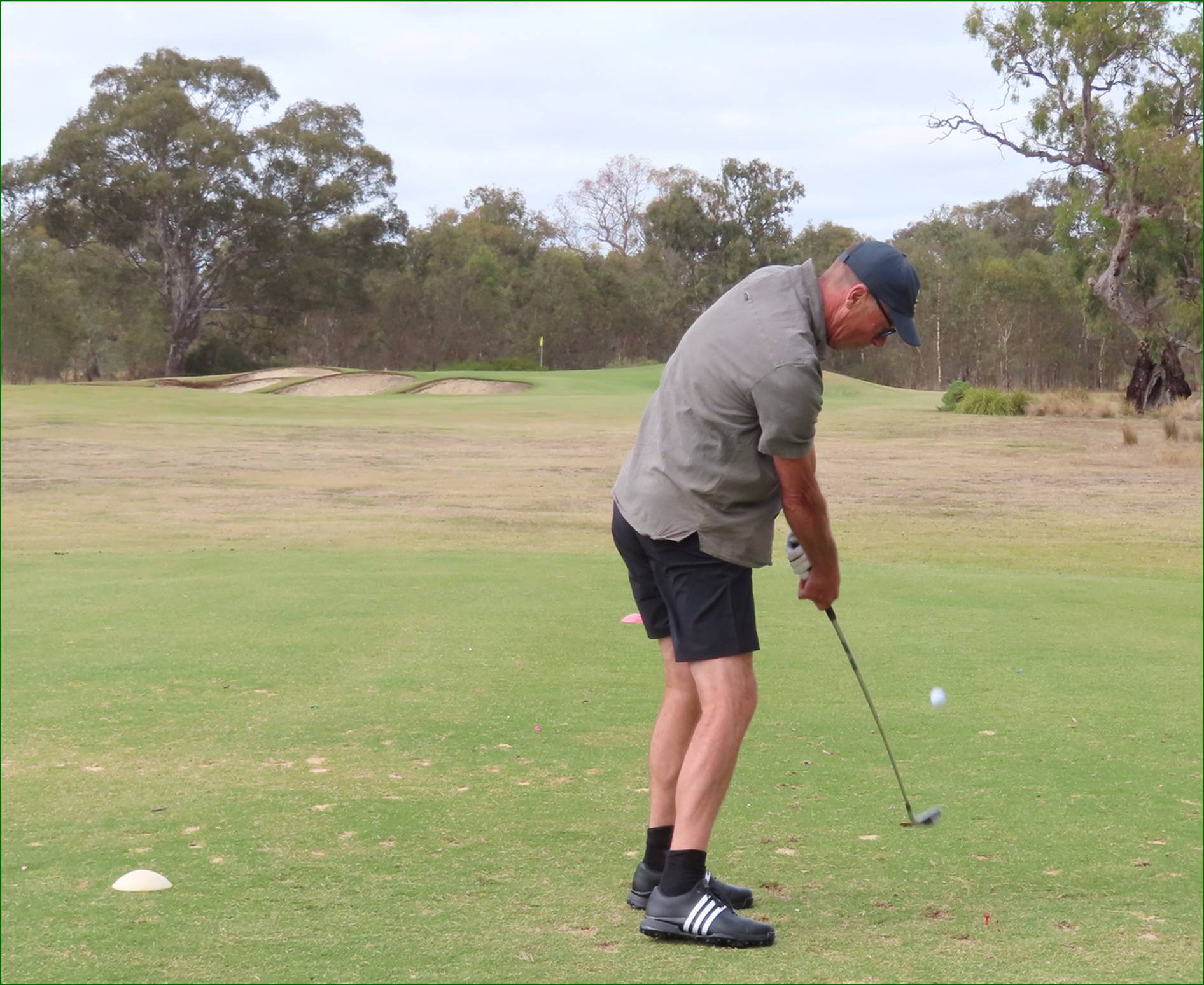 A person playing golf on a golf course

AI-generated content may be incorrect.