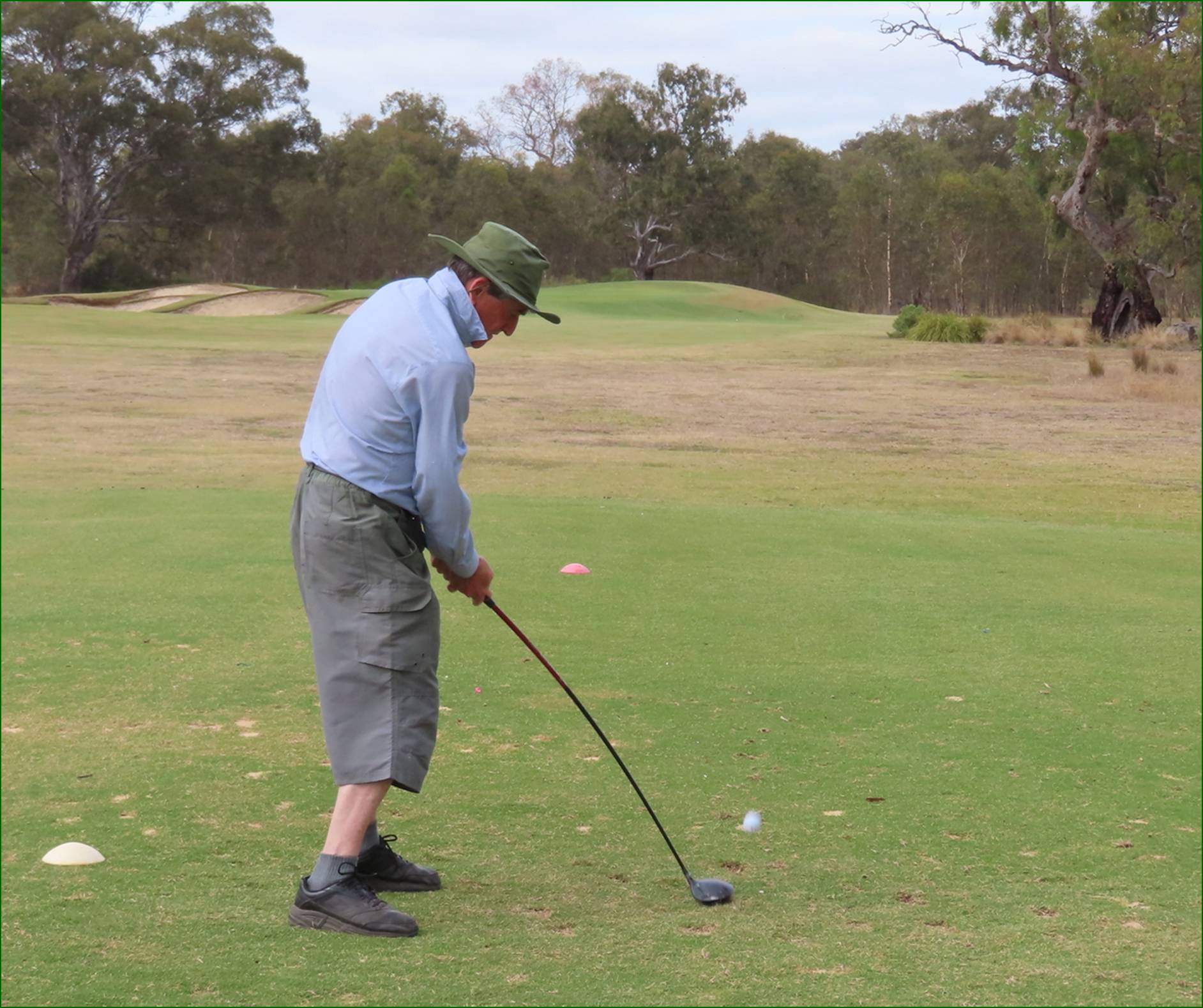 A person playing golf on a golf course

AI-generated content may be incorrect.