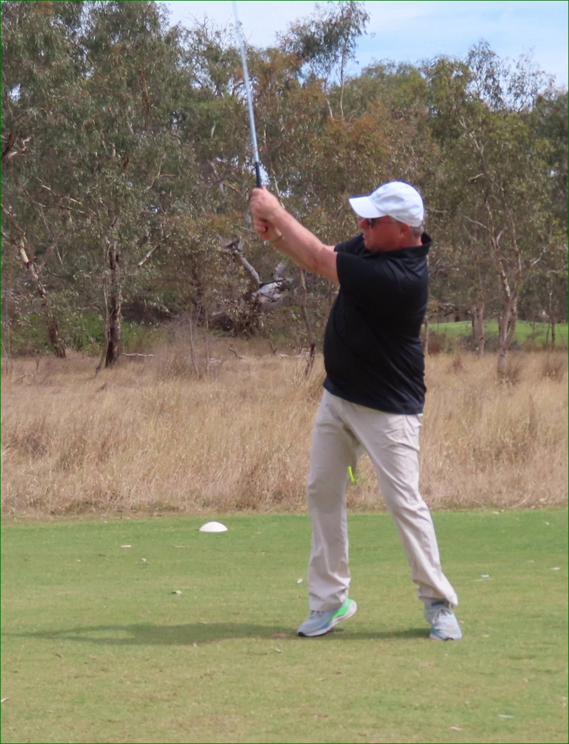 A person swinging a golf club

AI-generated content may be incorrect.