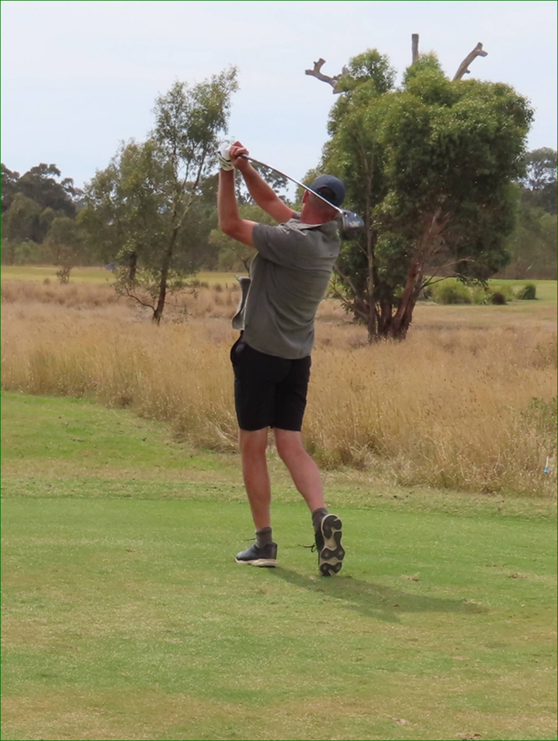 A person swinging a golf club

AI-generated content may be incorrect.