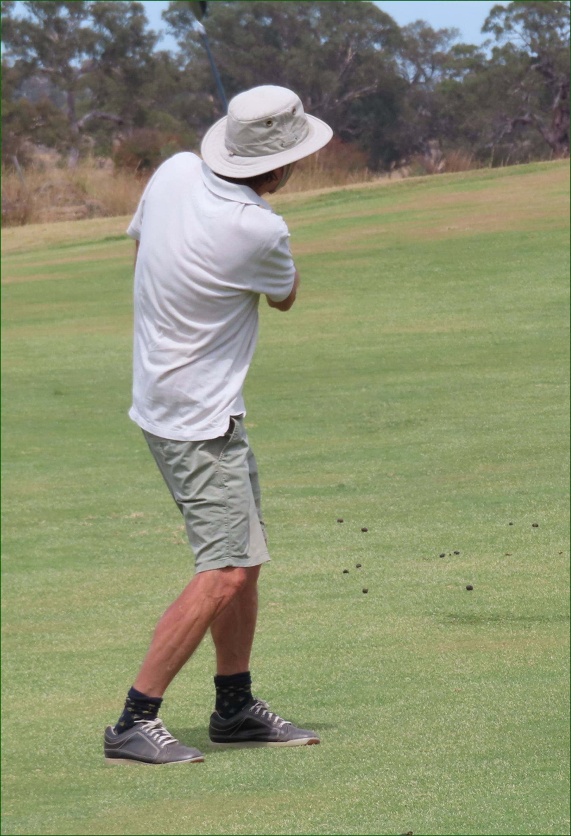 A person playing golf on a golf course

AI-generated content may be incorrect.