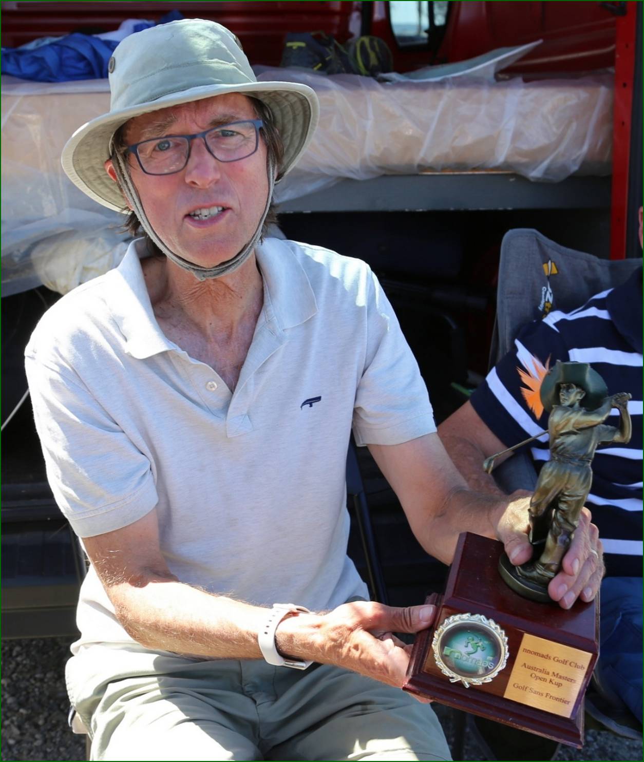 A person holding a trophy

AI-generated content may be incorrect.