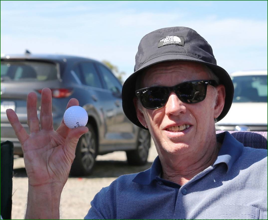 A person holding a golf ball

AI-generated content may be incorrect.